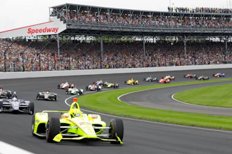 In this May 26, 2019, file photo, Simon Pagenaud, of France, leads the field through the first turn on the start of the Indianapolis 500 IndyCar auto race at Indianapolis Motor Speedway, in Indianapolis. Indianapolis Motor Speedway and the IndyCar Series have been sold to Penske Entertainment Corp. in a stunning announcement that relinquishes control of the iconic speedway from the Hulman family after 74 years.
