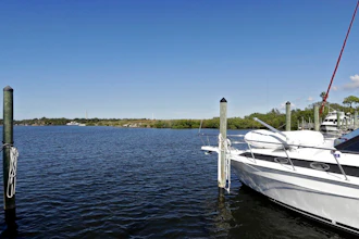 In this Nov. 30, 2017 photo, boats are shown moored in the Anclote River near the old Stauffer chemical plant site in Tarpon Springs, Fla. Hundreds of the nation's most polluted places are at an increasing risk of spreading contamination beyond their borders by more frequent storms and rising seas. Sixty percent of U.S. Superfund sites are in danger from weather extremes like hurricanes or wildfires, and the Trump administration’s reluctance to acknowledge and plan for climate change is hurting chances of safeguarding them, according to a government watchdog.