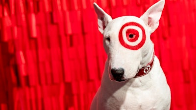 In this Wednesday, Oct. 23, 2019, photo Bullseye, a Miniature Bull Terrier and the official mascot of Target Corporation, poses for a photograph during a Target Holiday Outlook event in New York. Target Corp. says it's spending $50 million more on payroll during the fourth quarter than it did a year ago so that there'll be more workers on hand to help harried shoppers scrambling to get their shopping done in a shorter amount of time.