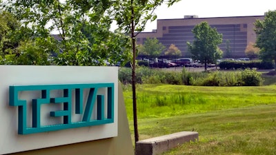 In this July 25, 2005 file photo, the offices of Teva Pharmaceuticals North America are seen in Horsham, Pa. At least a half-dozen companies that make or distribute prescription opioid painkillers are facing a federal criminal investigation of their roles in a nationwide addiction and overdose crisis. The Wall Street Journal first reported the investigation Tuesday, Nov. 26, 2019, citing unnamed sources familiar with the probe.