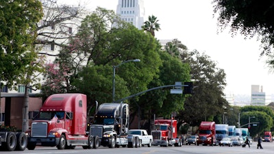 The California Trucking Association has filed what appears to be the first lawsuit challenging a sweeping new labor law that seeks to give wage and benefit protections to workers in the so-called gig economy.