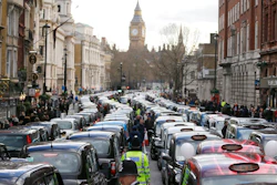 In this Wednesday, Feb. 10, 2016 file photo, London taxis block the roads during a protest in central London, concerned with unfair competition from services such as Uber. London’s transit operator says it is not renewing Uber’s license to operate in the British capital. Uber’s license expires Monday Nov. 25, 2019.