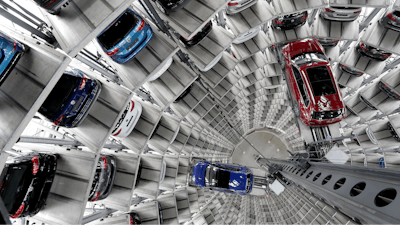 This file photo shows Volkswagen cars lifted inside a delivery tower in Wolfsburg, Germany.