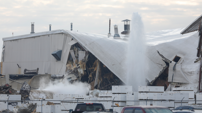 Authorities respond after a partial building collapse at Beechcraft aircraft manufacturing facility in Wichita, Kan., Friday, Dec. 27, 2019. More than a dozen people were injured Friday when a nitrogen line ruptured at the facility, causing part of the building to collapse, authorities said.
