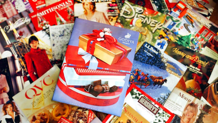 This Wednesday, Nov. 24, 2004 file photo shows a selection of holiday season catalogs in Portland, Maine. Catalogs, those glossy paper-and-ink offerings of outdoor apparel, kitchenware and fruit baskets, are not yet headed for the recycling bin of history.