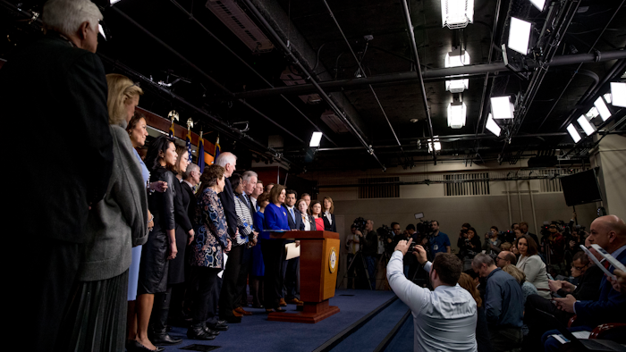 House Speaker Nancy Pelosi of Calif., accompanied by House Congress members, speaks at a news conference to discuss the United States Mexico Canada Agreement (USMCA) trade agreement, Tuesday, Dec. 10, 2019, on Capitol Hill in Washington.