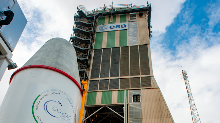 In this photo released on Saturday, Dec. 14, 2019 by the European Space Agency (ESA), the upper composite of the Soyuz that will lift ESA’s Cheops mission into space, along with the primary passenger, the Italian space agency’s Cosmo-SkyMed Second Generation satellite, and three CubeSats – including ESA’s OPS-SAT – is rolled into the mobile launch service tower at Europe’s Spaceport in Kourou, French Guiana. European space officials on Tuesday, Dec. 17, 2019 postponed the launch of a three-year mission to study planets in other solar systems shortly before it was due to blast off.