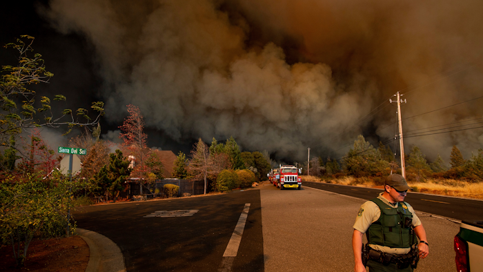 In this Nov. 8, 2018 file photo The Camp Fire rages through Paradise, Calif. An Associated Press review shows widespread problems with the four “public safety power shutoffs” the utility started rolling out in 2018, a year before massive blackouts paralyzed much of California in recent months. Interviews and documents obtained under public records requests reveal persistent failures and broken promises that in some cases compromised public safety.
