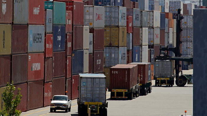 In this July 22, 2019, file stacked containers wait to be loaded on to trucks at the Port of Oakland in Oakland, Calif. China's government says trade negotiators are in “close communication” with Washington ahead of a weekend deadline for a U.S. tariff hike. But a Ministry of Commerce spokesman gave no indication of possible progress in trade talks or whether Washington might postpone the increase.
