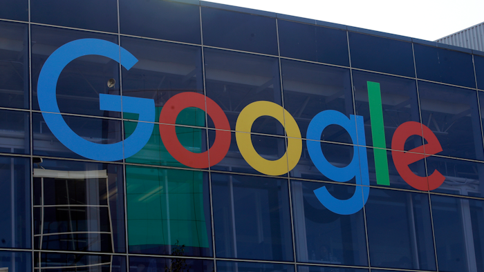 In this Sept. 24, 2019, file photo a sign is shown on a Google building at their campus in Mountain View, Calif. Google plans offer checking accounts run by Citigroup and a credit union, according to a report by The Wall Street Journal.