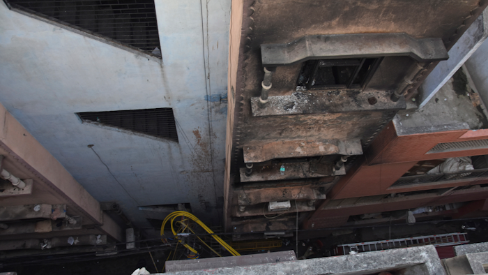 The walls of a building stand blackened after it caught fire in New Delhi, India, Sunday, Dec. 8, 2019. Dozens of people died on Sunday in a devastating fire at a building in a crowded grains market area in central New Delhi, police said. Firefighters fought the blaze from 100 meters (yards) away because it broke out in one of the area's many alleyways, tangled in electrical wire and too narrow for vehicles to access, authorities at the scene said.