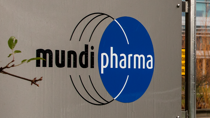 This Dec. 12, 2019, photo shows a sign at the Mundipharma International headquarters at Cambridge Science Park in England. Mundipharma is the international affiliate of Purdue Pharma, the maker of the blockbuster painkiller OxyContin. Mundipharma is now marketing Nyxoid, a new brand of naloxone, an opioid overdose reversal medication.