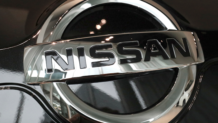 In this Feb. 9, 2017 file photo, the logo of the Nissan Motor Co. is seen on a car displayed at the gallery of its global headquarters in Yokohama, near Tokyo. Japanese securities regulators are recommending that automaker Nissan be fined 2.4 billion yen ($22 million) for the under-reporting of compensation of its former chairman, Carlos Ghosn. The Securities and Exchange Surveillance Commission said Tuesday, Dec. 10, 2019, it made the recommendation to the government's Financial Services Agency.