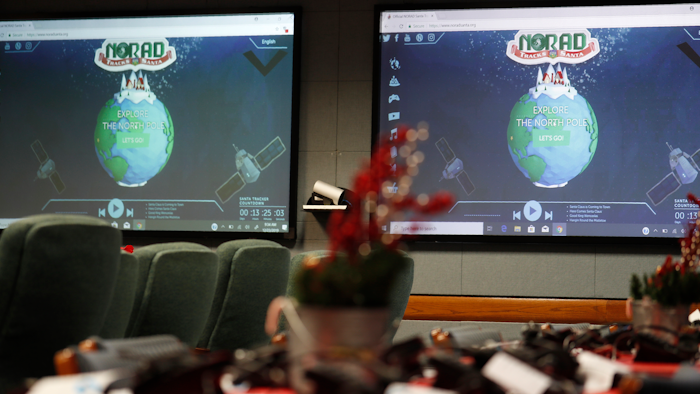 Monitors are illuminated in the NORAD Tracks Santa center at Peterson Air Force Base, Monday, Dec. 23, 2019, in Colorado Springs, Colo. More than 1,500 volunteers will answer an estimated 140,000 telephone calls from childfren and their parents who will be checking on the whereabouts of Santa Clau on Christmas Eve.