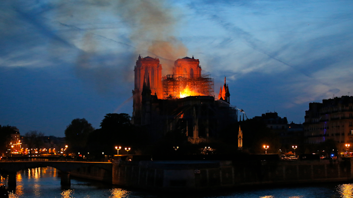 Flames and smoke rise from Notre Dame cathedral in Paris as firefighters tackle the blaze on April 15, 2019.