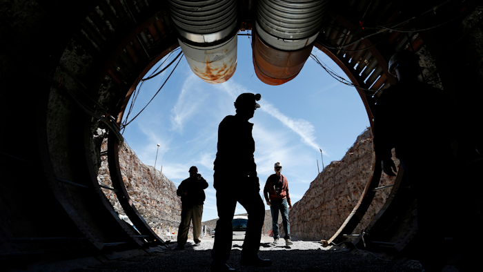 In this April 9, 2015, file photo, people walk into the south portal of Yucca Mountain during a congressional tour of the proposed radioactive waste dump near Mercury, Nev., 90 miles northwest of Las Vegas. Nevada is branding federal shipments of weapons-grade plutonium to the state a year ago as a 'secret ... smuggling operation,' and urging a U.S. District Court judge in Reno to reject a bid to dismiss a lawsuit because the Energy Department has already promised no more material will be brought to the state. A court filing Monday, Dec. 16, 2019, seeks oral arguments in a yearlong legal battle over the state's bid for a court order to remove the highly radioactive material from a vast secure government reservation north of Las Vegas.