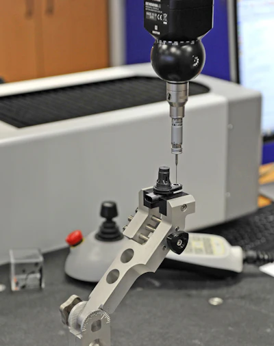 Tactile probing the ABS sensor body.