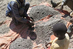 François and his 13-year-old son, Charles, sort stones before taking them to a nearby trading house that buys the ore, Democratic Republic of Congo, 2016.