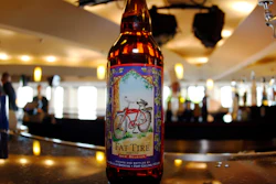 In this April 13, 2008, file photo, a bottle of Fat Tire Amber Ale, made by New Belgium Brewing Co., sits on the bar in the club level of the Pepsi Center in Denver. Employees approved the sale of one of the largest U.S. craft breweries to a subsidiary of Japanese beverage company Kirin in a vote that ended Tuesday, Dec. 17, 2019, clearing the way for the sale to close by the end of the year. New Belgium Brewing Co. declined to release the number of employees who voted in favor of the sale to Lion Little World Beverages of Australia or a breakdown of how they voted, the Coloradoan reported.