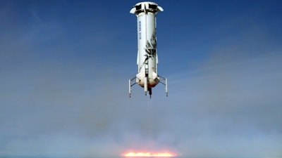In this image provided by Blue Origin, the New Shepard rocket booster lands near Van Horn, Texas. Blue Origin, Jeff Bezos' space company, has scored another successful spaceflight, when it launched and landed the same rocket for the sixth time Wednesday.