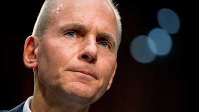 In this Oct. 29, 2019, file photo Boeing Company President and Chief Executive Officer Dennis Muilenburg appears before a Senate Committee on Commerce, Science, and Transportation hearing on 'Aviation Safety and the Future of Boeing's 737 MAX' on Capitol Hill in Washington. Muilenburg is resigning amid ongoing problems at the company over the troubled Max 737 aircraft. The board of directors said Monday, Dec. 23 that Muilenburg is stepping down immediately. The board's current chairman David Calhoun will become president and CEO on Jan. 13, 2020.