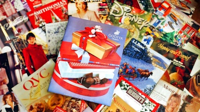 This Wednesday, Nov. 24, 2004 file photo shows a selection of holiday season catalogs in Portland, Maine. Catalogs, those glossy paper-and-ink offerings of outdoor apparel, kitchenware and fruit baskets, are not yet headed for the recycling bin of history.