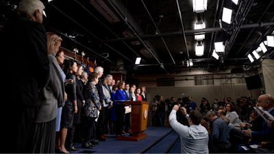 House Speaker Nancy Pelosi of Calif., accompanied by House Congress members, speaks at a news conference to discuss the United States Mexico Canada Agreement (USMCA) trade agreement, Tuesday, Dec. 10, 2019, on Capitol Hill in Washington.