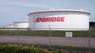 This June 29, 2018 photo shows tanks at the Enbridge Energy terminal in Superior, Wis. An updated environmental review released by a state agency Monday, Dec. 9, 2019, found no serious threat to Lake Superior if crude oil ever leaked from a new pipeline to replace Enbridge Energy's aging Line 3 across northern Minnesota.