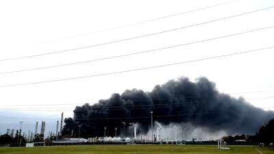 Thick smoke following an overnight explosion, Nov. 27, 2019, in Port Neches, Texas.