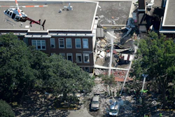In this Aug. 2, 2017 file photo, emergency workers respond to an explosion at Minnehaha Academy in Minneapolis. Federal investigators say a pipefitting crew lacked proper training when they moved a gas meter just before a Minneapolis school explosion that killed two people in 2017. The National Transportation Safety Board released its report Monday, Dec. 2, 2019 on the explosion at Minnehaha Academy.