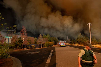 In this Nov. 8, 2018 file photo The Camp Fire rages through Paradise, Calif. An Associated Press review shows widespread problems with the four “public safety power shutoffs” the utility started rolling out in 2018, a year before massive blackouts paralyzed much of California in recent months. Interviews and documents obtained under public records requests reveal persistent failures and broken promises that in some cases compromised public safety.