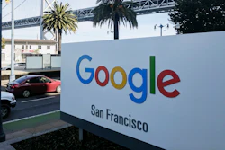 In this Oct. 31, 2018, file photo shows signage outside the offices of Google in San Francisco with the San Francisco-Oakland Bay Bridge in the background. Four workers fired from Google in November 2019 are planning to file charges against the company with a federal agency. They are claiming the company unfairly retaliated against them for organizing workers around social causes.
