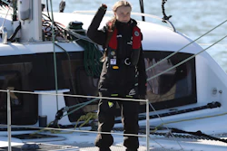 Climate activist Greta Thunberg waves as she arrives in Lisbon aboard the sailboat La Vagabonde Tuesday, Dec 3, 2019. Thunberg has arrived by catamaran in the port of Lisbon after a three-week voyage across the Atlantic Ocean from the United States. The Swedish teen sailed to the Portuguese capital before heading to neighboring Spain to attend the U.N. Climate Change Conference taking place in Madrid.