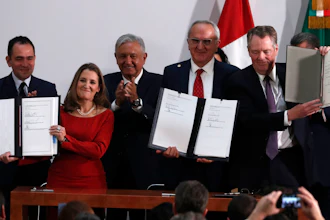 Mexico's Treasury Secretary Arturo Herrera, left, Deputy Prime Minister of Canada Chrystia Freeland, second left, Mexico's President Andres Manuel Lopez Obrador, center, Mexico's top trade negotiator Jesus Seade, second right, and U.S. Trade Representative Robert Lighthizer, hold the documents after signing an update to the North American Free Trade Agreement, at the national palace in Mexico City, Tuesday, Dec. 10. 2019.