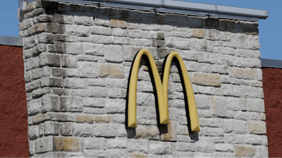 This Oct. 17, 2019, file photo shows the exterior of a McDonald's restaurant in Mebane, N.C. The National Labor Relations Board has ruled in McDonald's favor in a long-running case filed by 20 workers who faced retaliation for trying to unionize. The board says it favors a settlement that will require McDonald's franchisees to pay back wages to the affected workers.