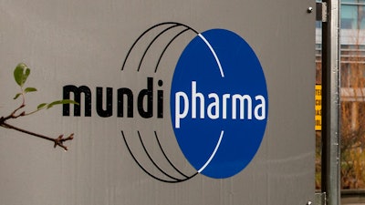 This Dec. 12, 2019, photo shows a sign at the Mundipharma International headquarters at Cambridge Science Park in England. Mundipharma is the international affiliate of Purdue Pharma, the maker of the blockbuster painkiller OxyContin. Mundipharma is now marketing Nyxoid, a new brand of naloxone, an opioid overdose reversal medication.