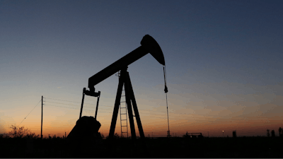 In this June 11, 2019, photo a pump jack operates in an oil field in the Permian Basin in Texas. The world may be heading into an oversupply of oil, and that possibility is hanging over members of the OPEC cartel, which will meet later this week to decide whether to further cut production to boost prices.