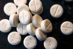 This June 17, 2019, file photo shows 5-mg pills of Oxycodone. The judge overseeing the bankruptcy case of OxyContin maker Purdue Pharma will consider Wednesday, Dec. 4, 2019 whether the company's CEO should get a bonus equal to half his $2.6 million salary.