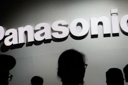 In this Jan. 9, 2018, file photo, people walk by the Panasonic booth during CES International in Las Vegas. Japanese electronics manufacturer Panasonic Corp. is abandoning the semiconductor business with the sale of its last business in that sector to a Taiwanese company. Panasonic said Thursday it was transferring the semiconductor business operated by Panasonic Semiconductor Solutions Co. to Nuvoton Technology Corp.