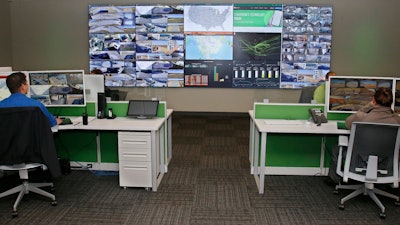 Paycom personnel monitor physical and IT security in the command center at the Oklahoma City Paycom campus Monday, Nov. 25, 2019, in Oklahoma City. Company officials say they ramped-up security after a disgruntled ex-worker began frightening employees with threatening messages and social media posts.
