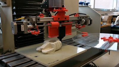 A proof-of-concept demonstration of a robotic device forming a raw material by closely controlling deformation of the material and position of the machine.