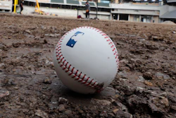 A baseball lies on packed dirt after for a short batting practice during a tour of the under construction baseball field at the new Texas Rangers stadium in Arlington, Texas, Wednesday, Dec. 4, 2019.