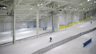Snowboarders and skiers enjoy the grand opening of Big Snow in East Rutherford, N.J., Thursday, Dec. 5, 2019. The facility, which is part of the American Dream mega-mall, is North America's first indoor ski and snowboard slope with real snow.