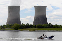 In this April 29, 2015 file photo, a boat travels on the Tennessee River near the Watts Bar Nuclear Plant near Spring City, Tenn. Federal regulators have fined the nation’s largest public utility $145,000 for submitting incomplete and inaccurate information on a backup system at its Watts Bar Nuclear Plant. The Nuclear Regulatory Commission notified the Tennessee Valley Authority of the proposed fine regarding the Spring City, Tennessee plant in a Nov. 19, 2019 letter. The utility says it has taken corrective action, adding that the backup configuration was never used.