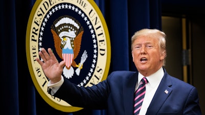 President Donald Trump waves during a summit on transforming mental health treatment to combat homelessness, violence, and substance abuse, at the he Eisenhower Executive Office Building on the White House complex in Washington, Thursday, Dec. 19, 2019, in Washington.