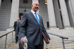In this Oct. 22, 2019, file photo, Ted Wells, Jr., the lead attorney for Exxon, leaves New York Supreme Court in New York, after opening arguments in a lawsuit against Exxon. Exxon Mobil prevailed Tuesday, Dec. 10, 2019, in a lawsuit accusing the energy giant of downplaying the toll that climate change regulations could take on its business, with a judge saying the state attorney general's case didn't prove the company deceived investors — but also didn't excuse it of any accountability for global warming.