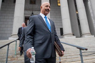 In this Oct. 22, 2019, file photo, Ted Wells, Jr., the lead attorney for Exxon, leaves New York Supreme Court in New York, after opening arguments in a lawsuit against Exxon. Exxon Mobil prevailed Tuesday, Dec. 10, 2019, in a lawsuit accusing the energy giant of downplaying the toll that climate change regulations could take on its business, with a judge saying the state attorney general's case didn't prove the company deceived investors — but also didn't excuse it of any accountability for global warming.