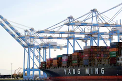 In this Nov. 4, 2019, file photo cargo cranes are used to take containers off of a Yang Ming Marine Transport Corporation boat at the Port of Tacoma in Tacoma, Wash. President Donald Trump says he “will make a decision very soon’’ about whether to impose tariffs on imported cars and auto parts.