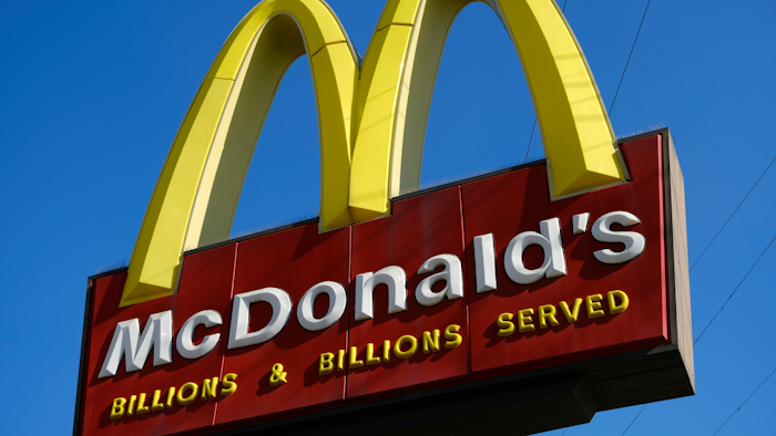 This Nov. 25, 2019, file photo shows McDonald's sign above the fast food restaurant near downtown Los Angeles. The Labor Department issued a final rule Sunday, Jan. 12, 2020, that clarifies when a worker is employed by more than one company, an issue that affects franchise businesses such as McDonald's and firms that have outsourced services such as cleaning and maintenance.