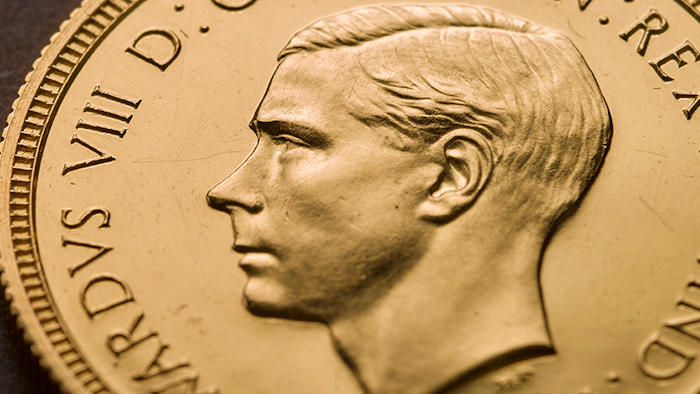 In this undated photo made available by The Royal Mint, a view of a rare Edward VIII Sovereign coin. One of the world's most rare coins featuring the uncle of Britain's Queen Elizabeth II, has been purchased for 1 million pounds ($1.3 million) in a new record for the sale of a British coin. The historical oddity shows King Edward VIII before he abdicated the throne in 1936 in order to marry American divorcee Wallis Simpson. The 22-carat gold coins were never released to the public.